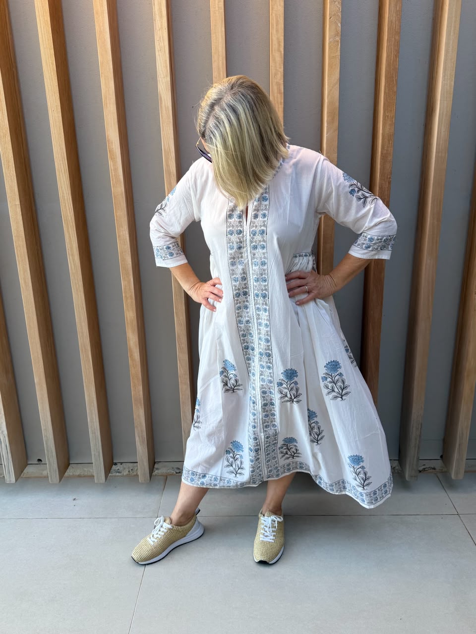 White dress with blue floral pattern