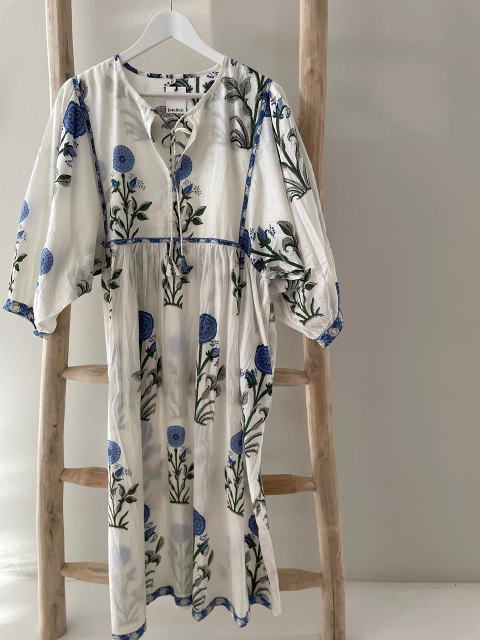 White dress with blue poppy