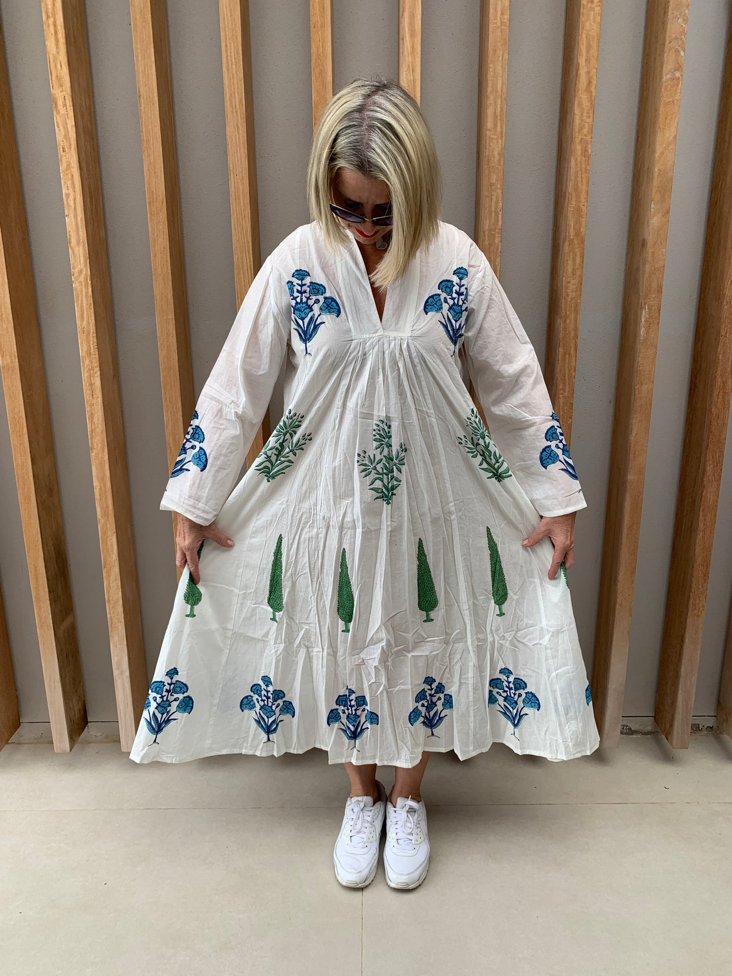 White dress with blue floral & green conifer pattern