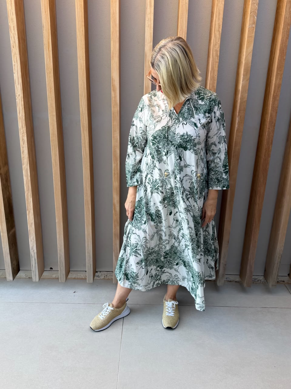 White dress with green animal palm pattern