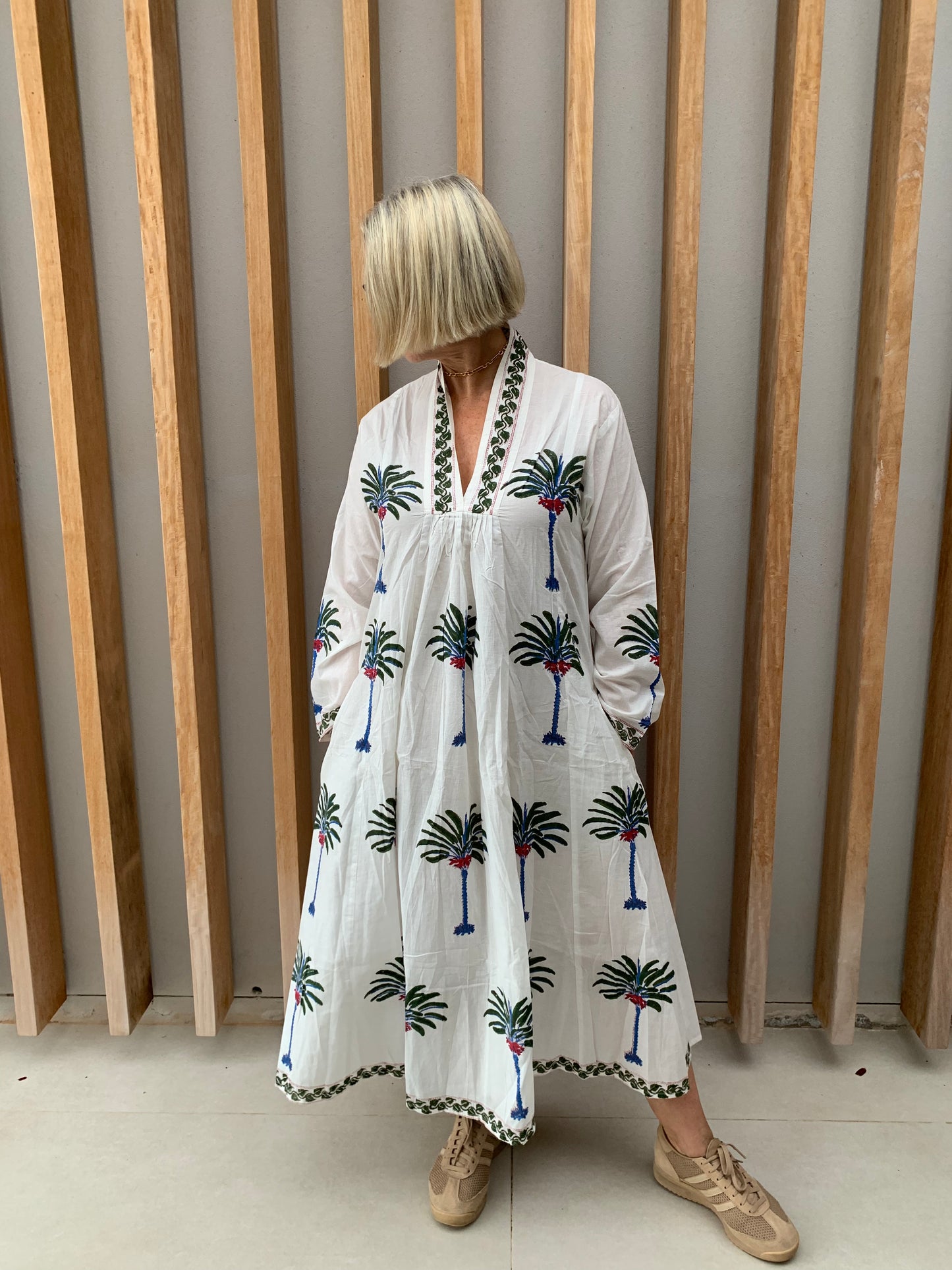 White dress with green & blue palm floral pattern