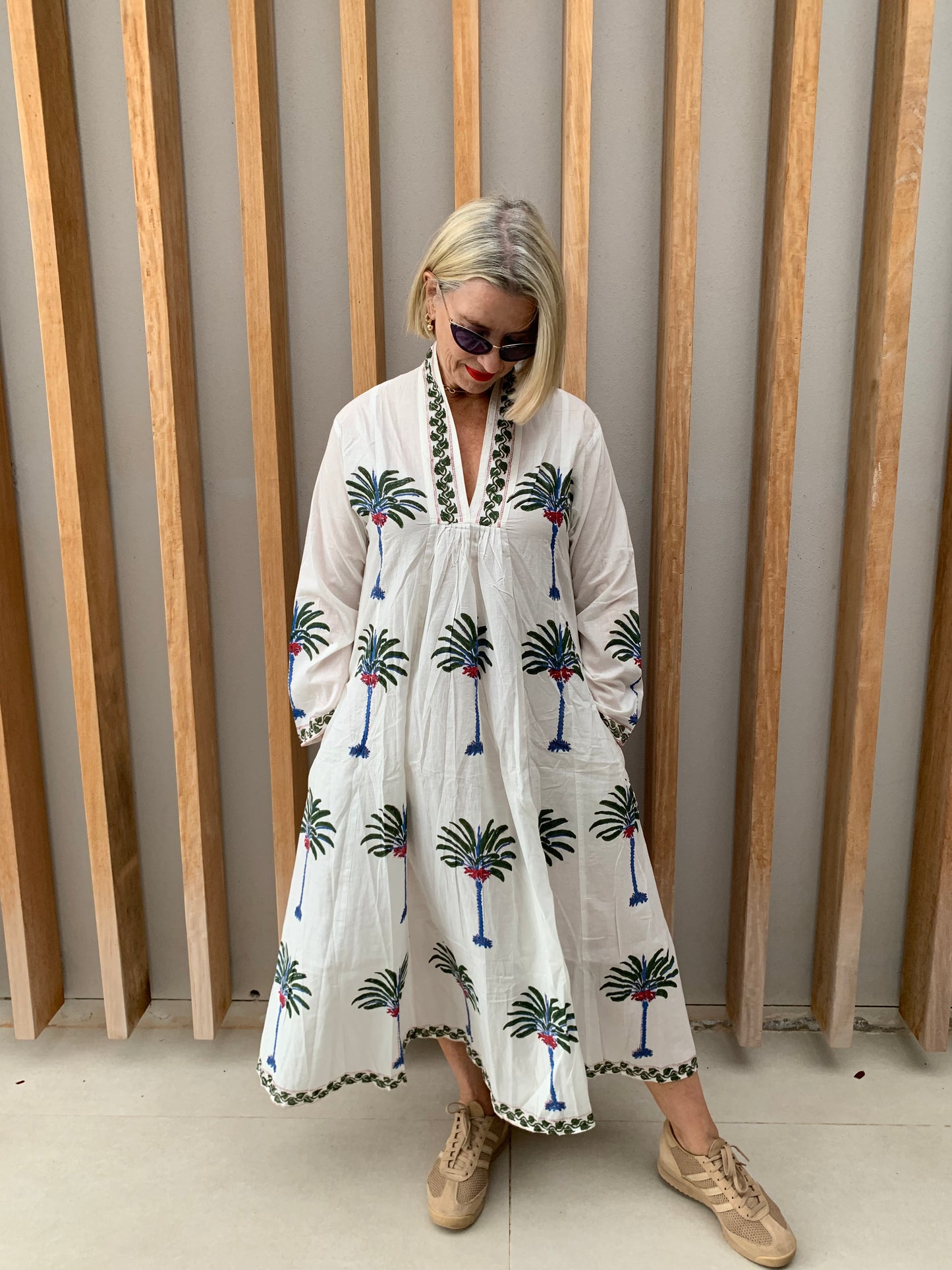 White dress with green & blue palm floral pattern
