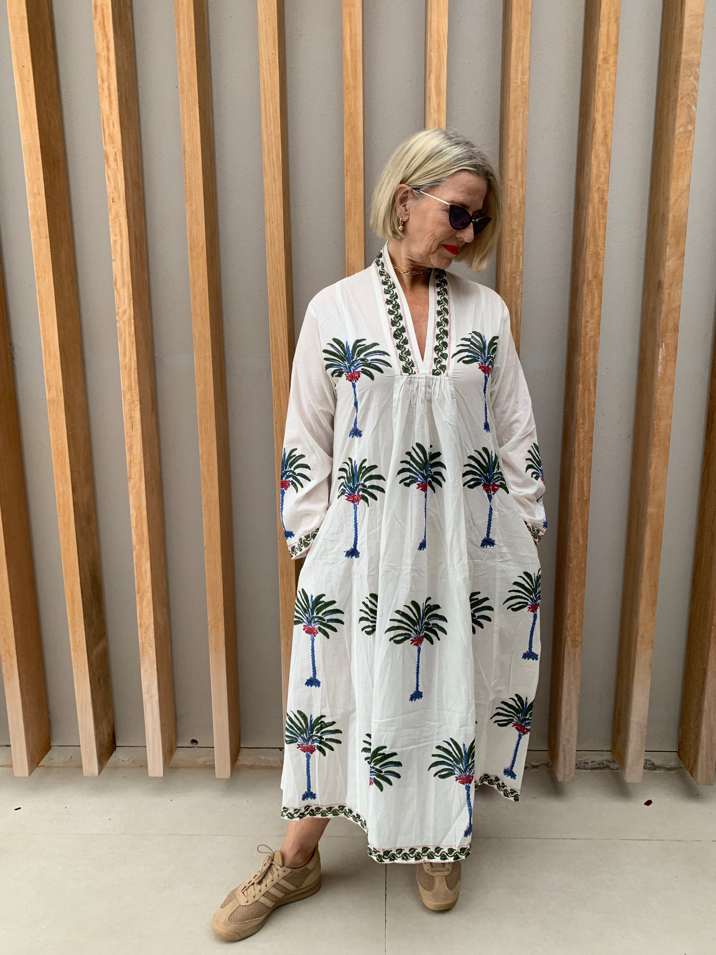 White dress with green & blue palm floral pattern