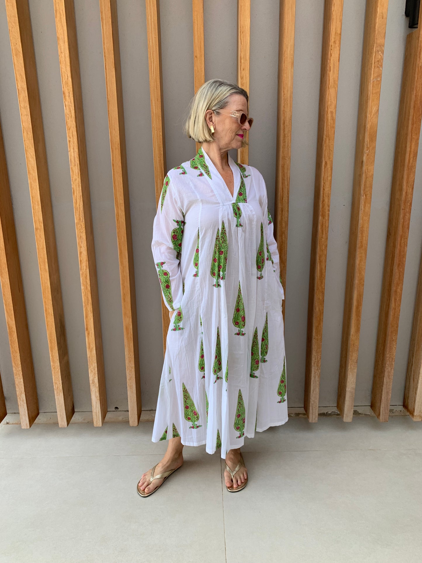 White dress with green conifer pattern