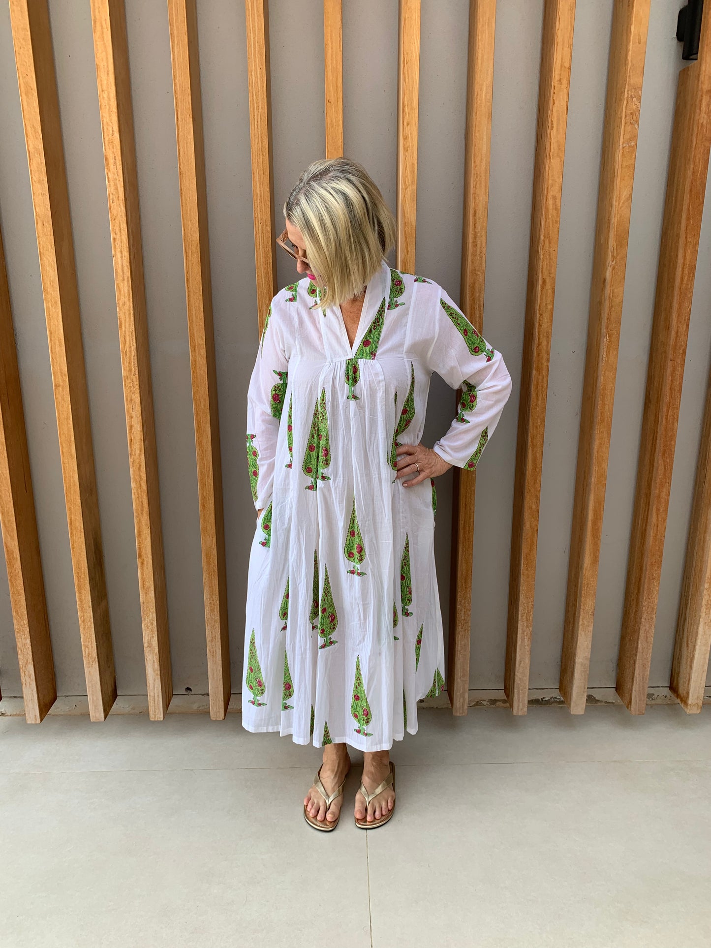 White dress with green conifer pattern