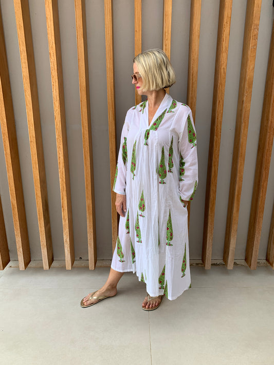 White dress with green conifer pattern