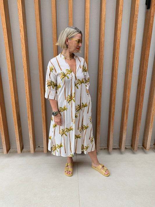 White dress with green palm floral pattern