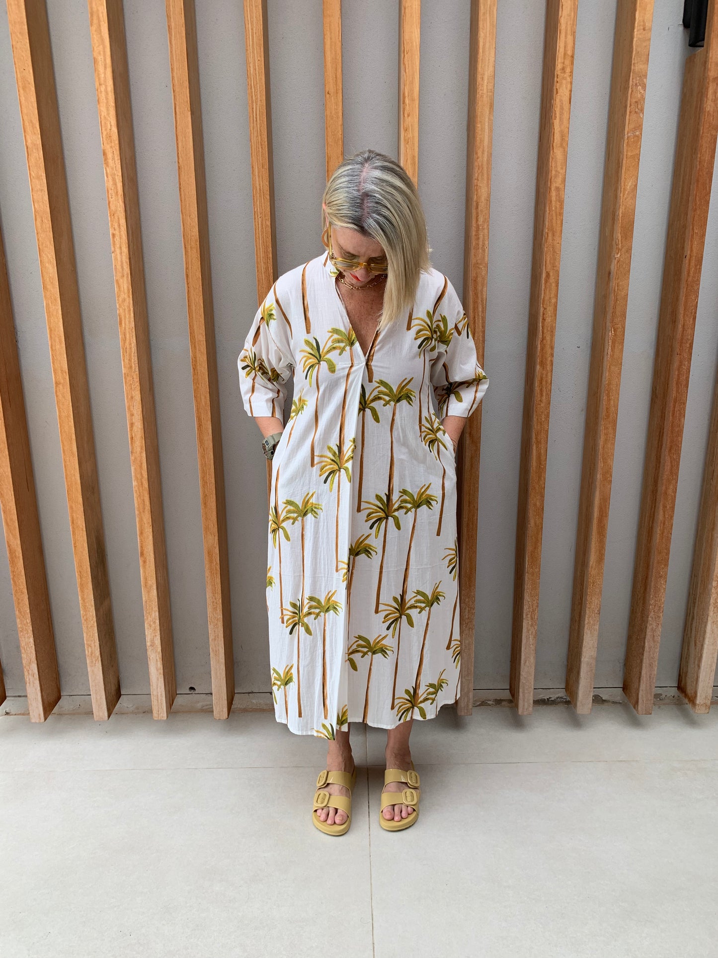 White dress with green palm floral pattern