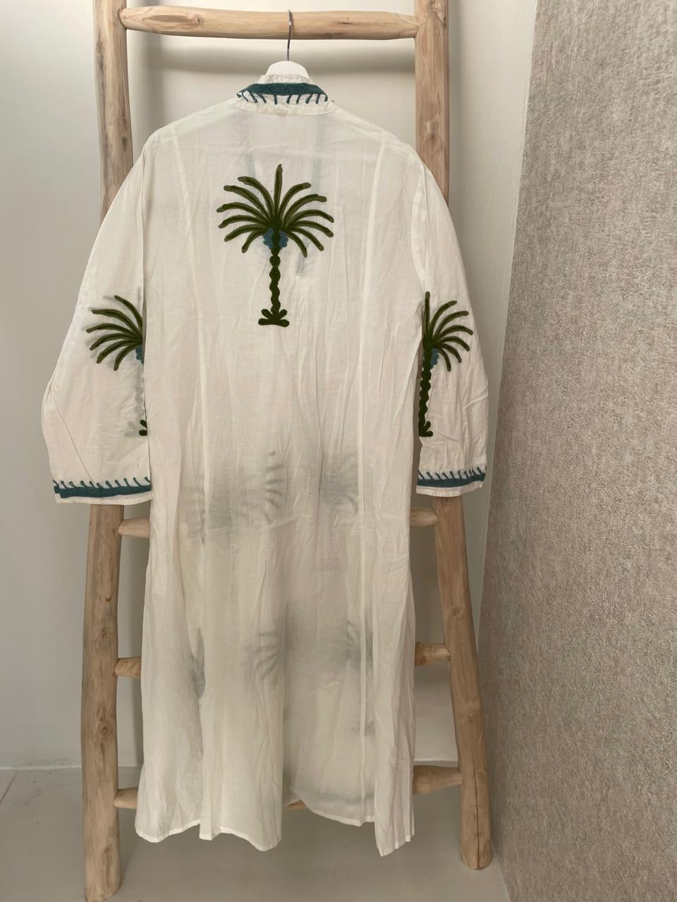 White dress with embroidered green floral palm