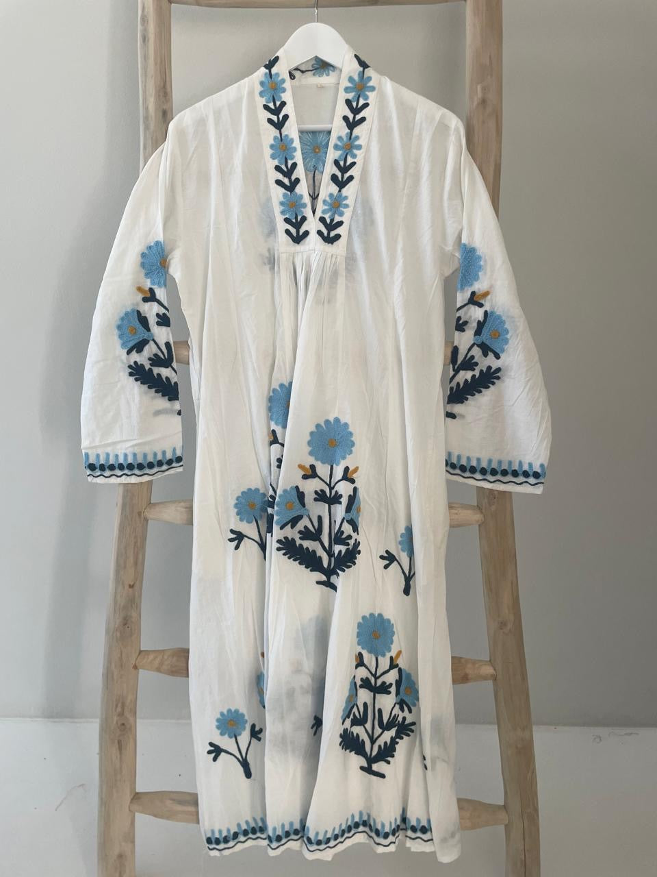 White dress with embroidered blue & green daisies