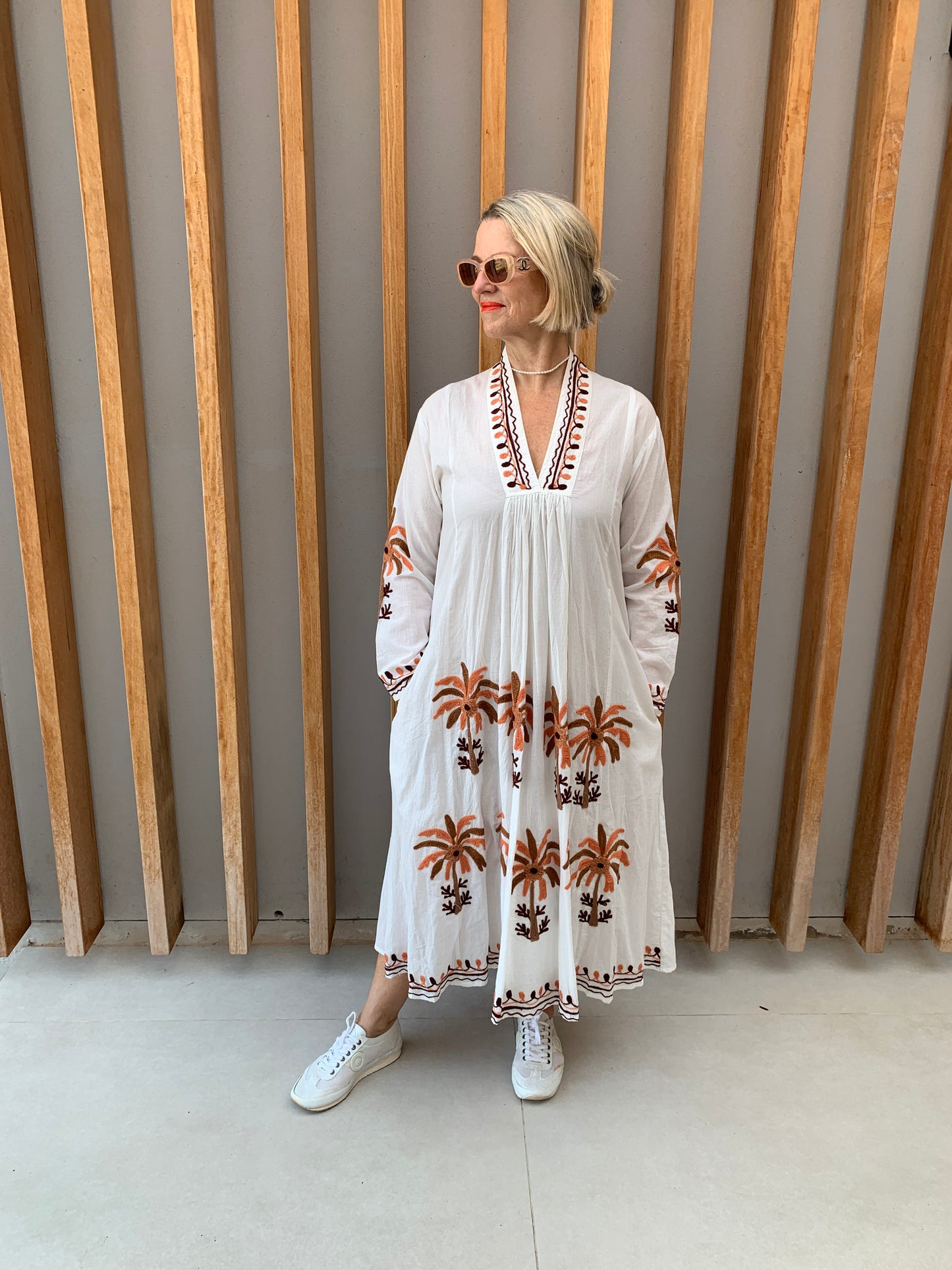 White dress with embroidered orange & brown palm