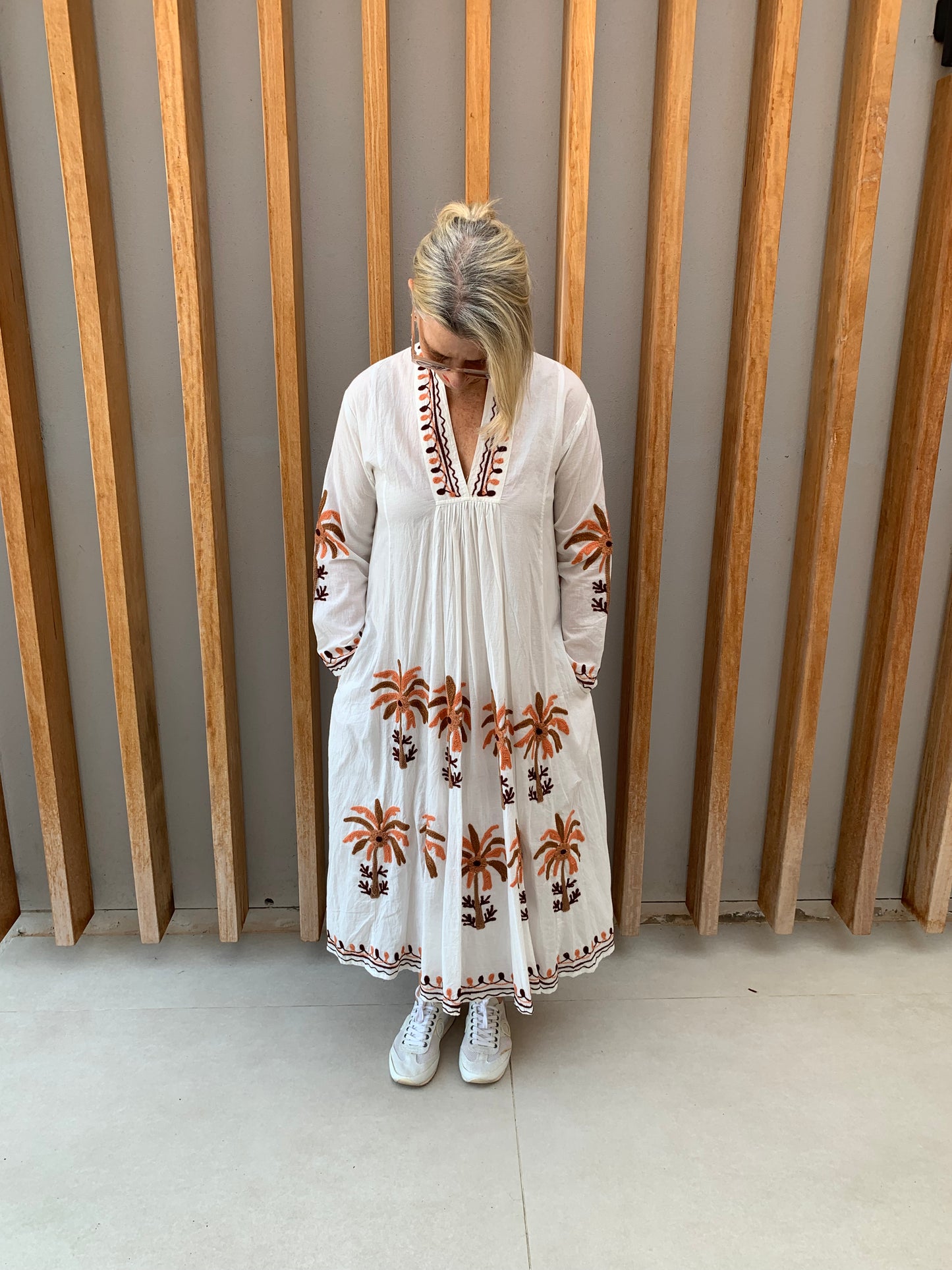 White dress with embroidered orange & brown palm