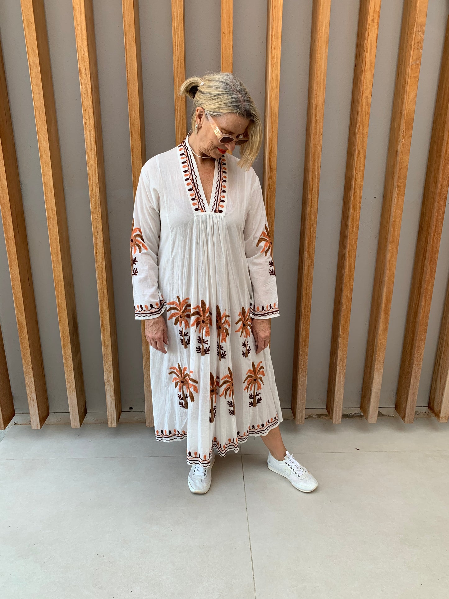 White dress with embroidered orange & brown palm