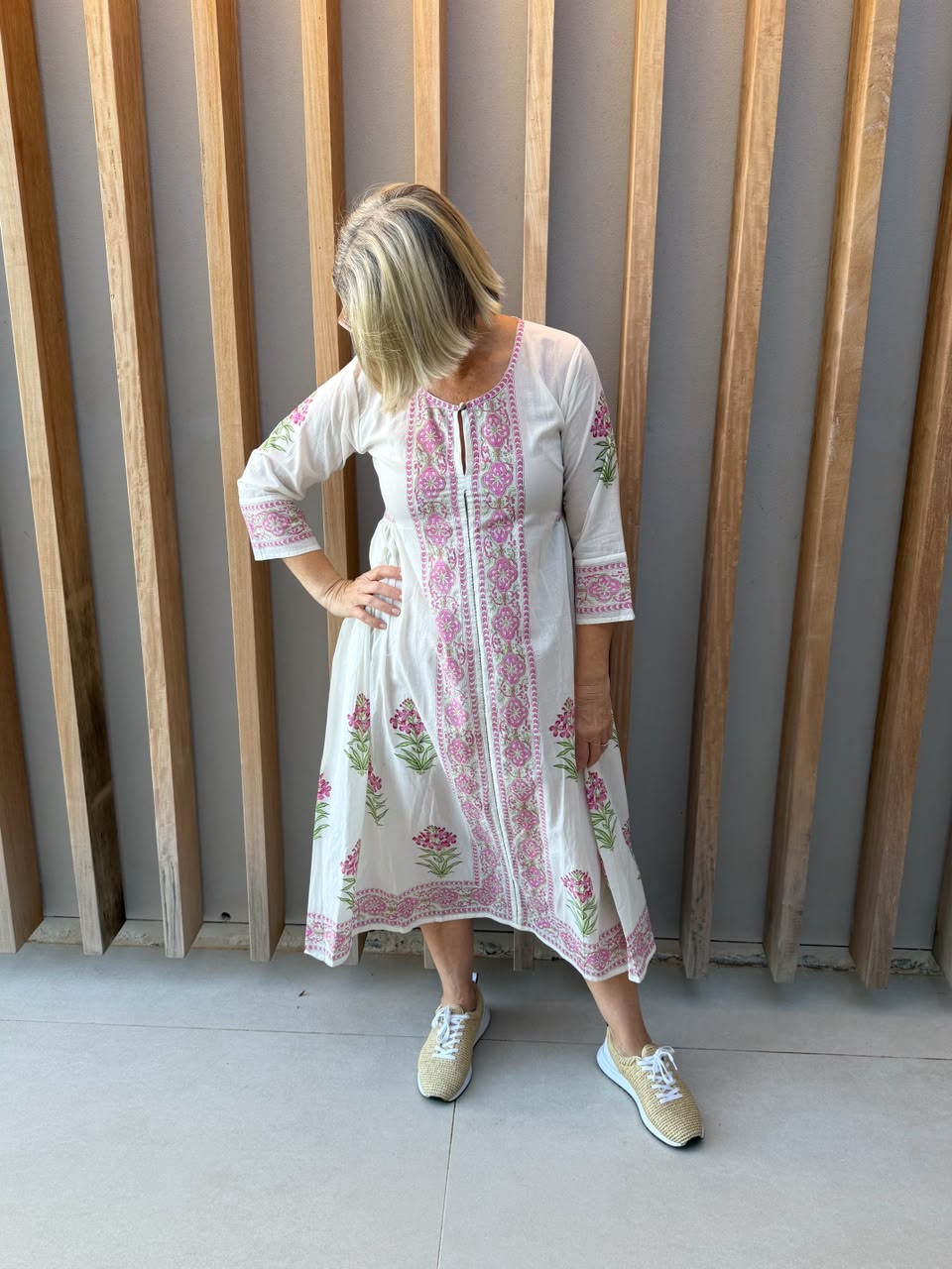 White dress with pink floral pattern