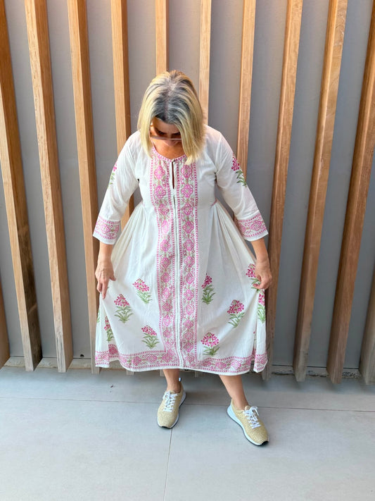 White dress with pink floral pattern