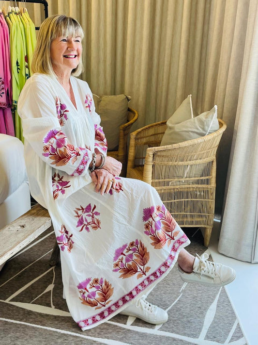 White dress with red floral pattern