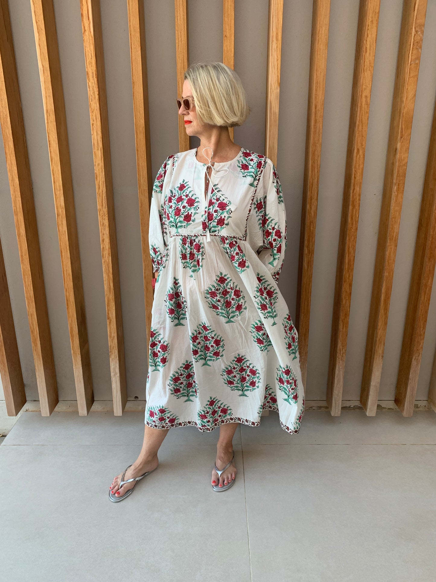 White dress with green tree & red flower pattern