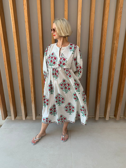 White dress with green tree & red flower pattern