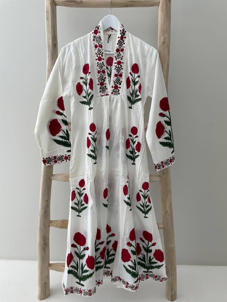 White dress with red poppy pattern