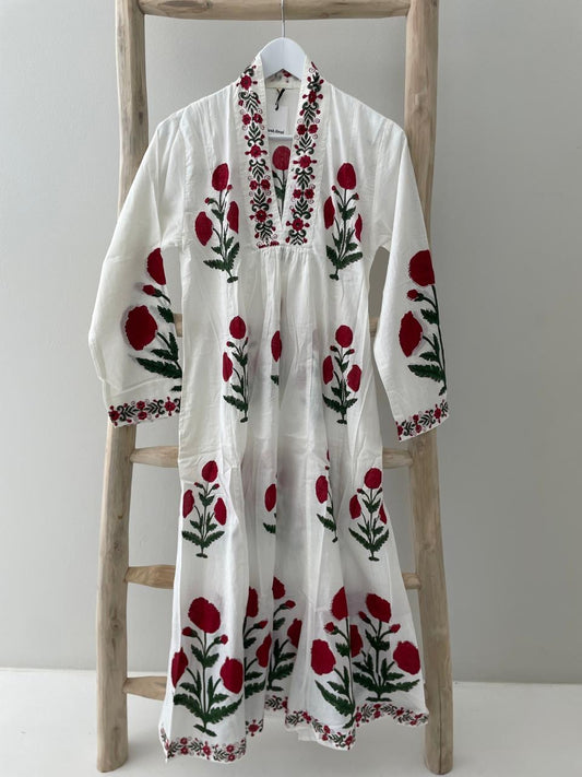 White dress with red poppy pattern