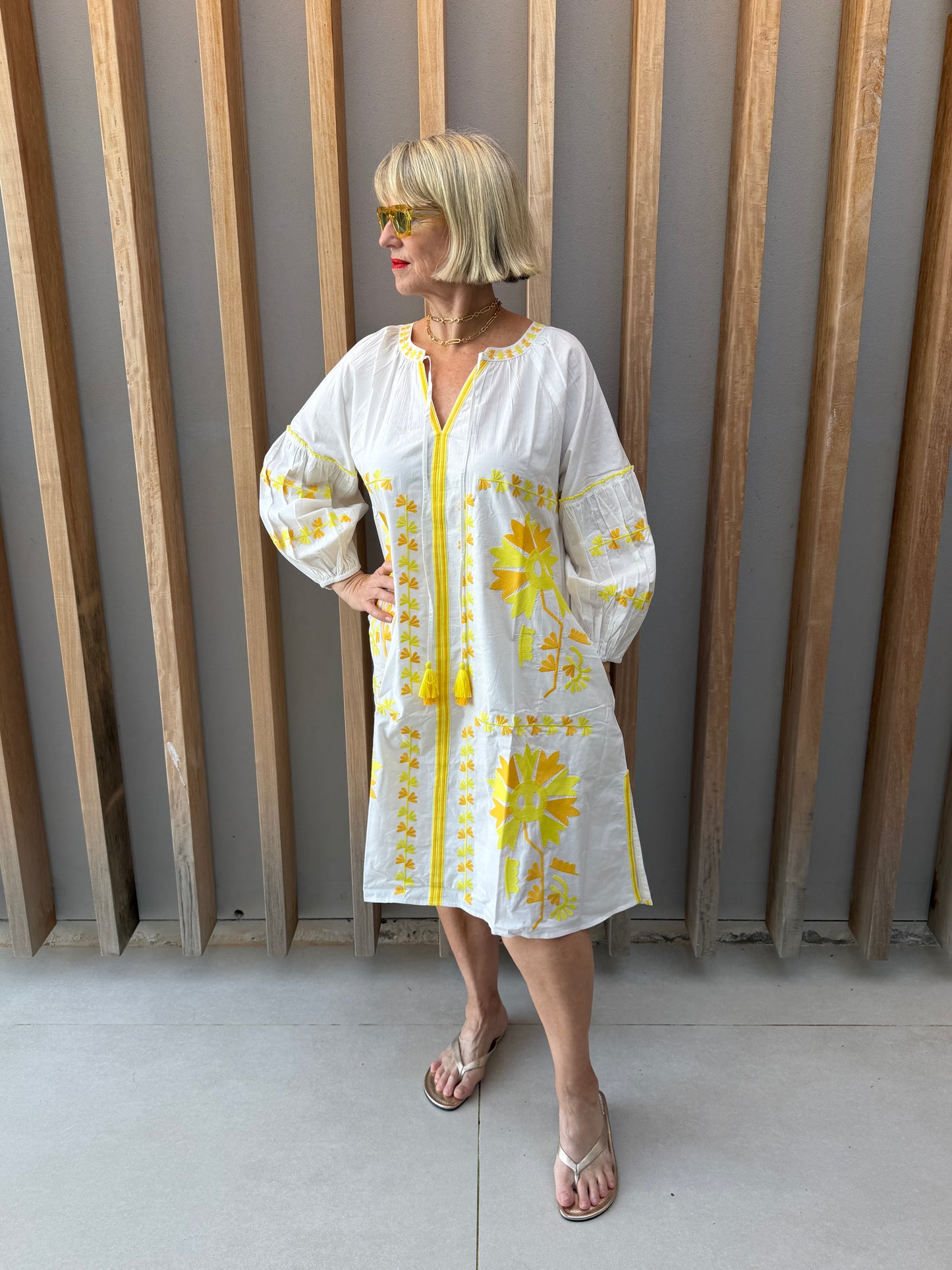 White dress with yellow embroidered pattern