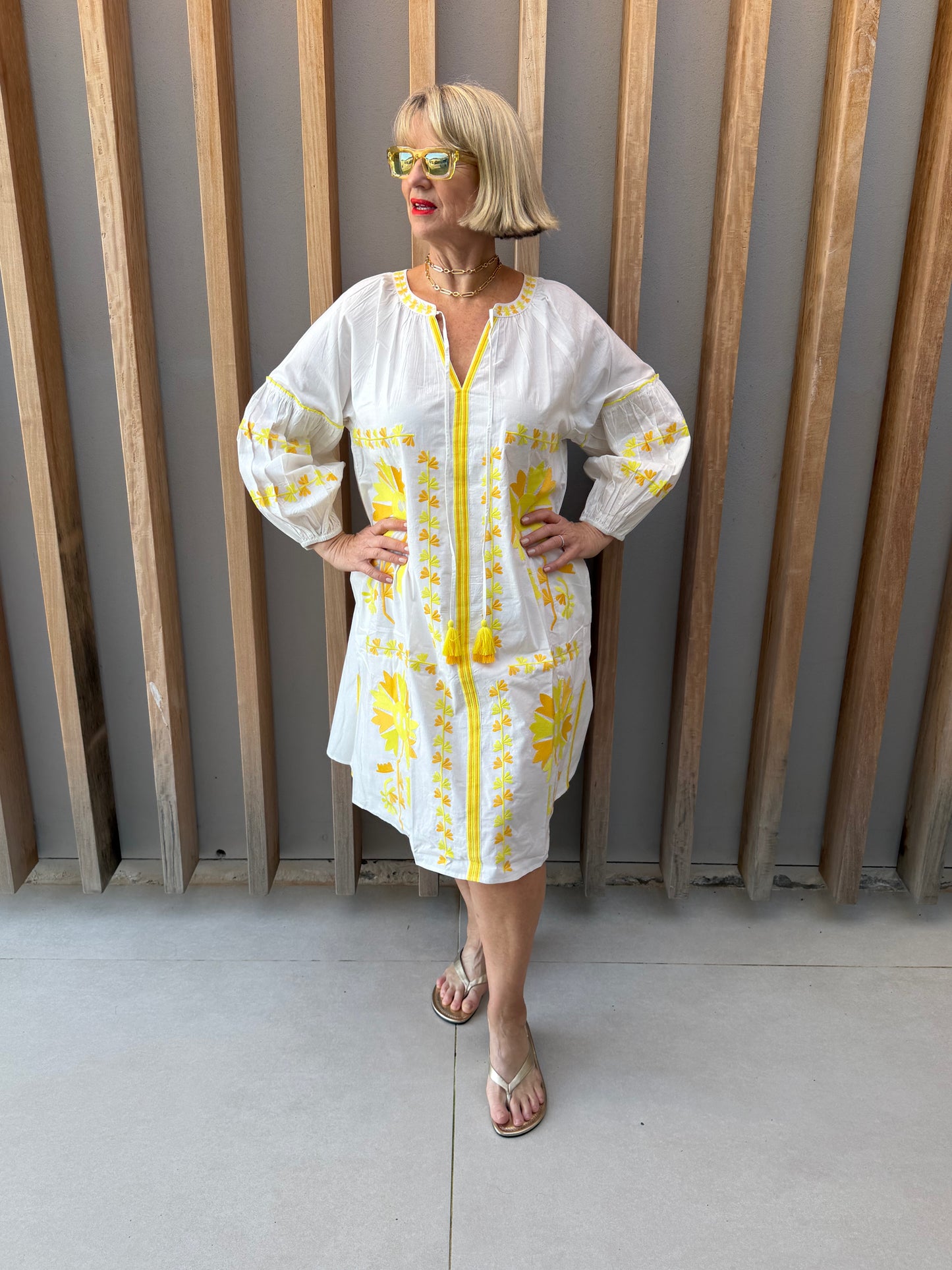 White dress with yellow embroidered pattern
