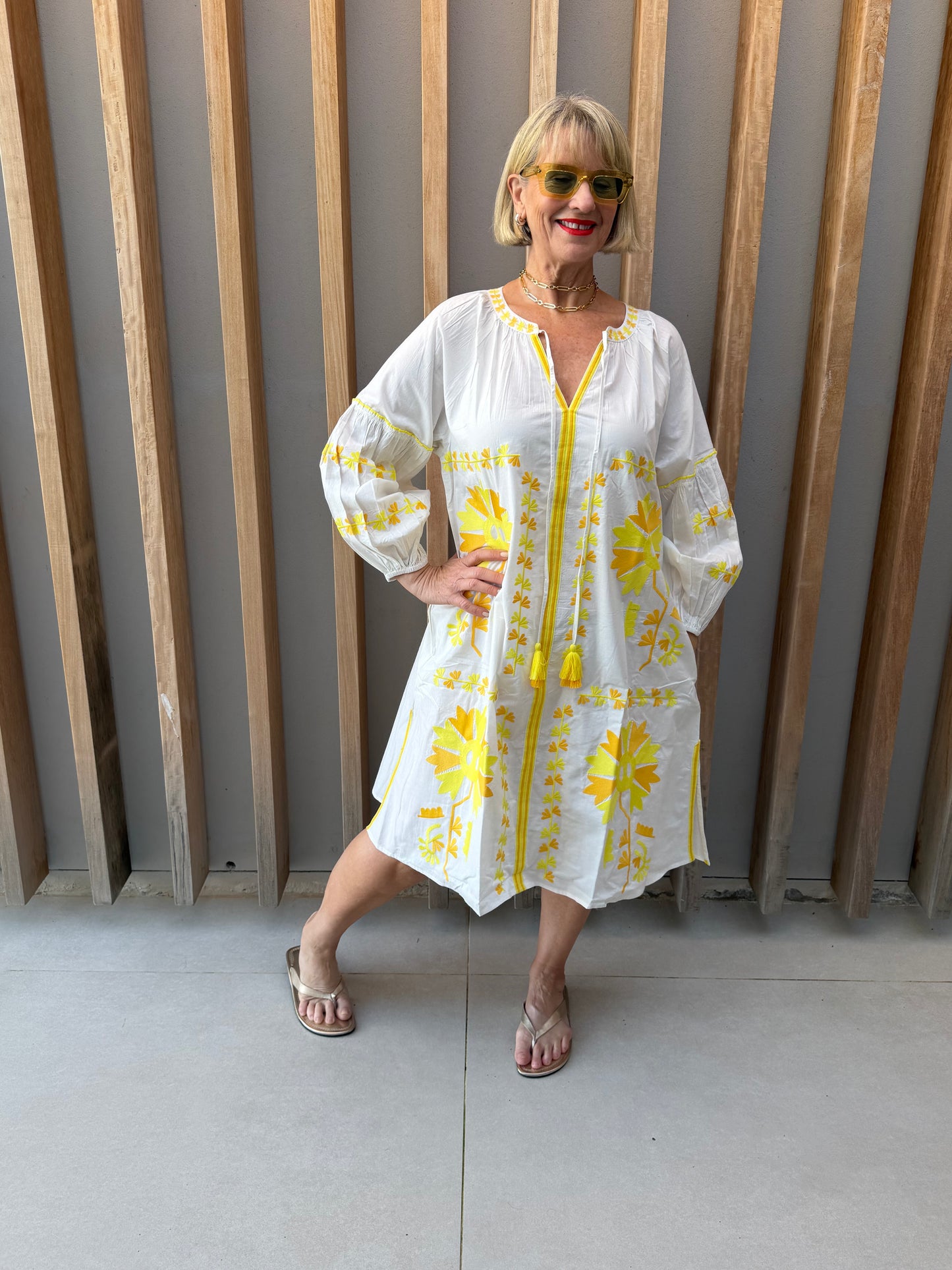 White dress with yellow embroidered pattern