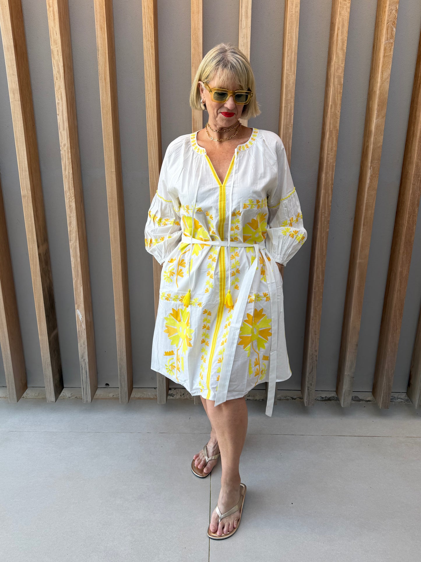 White dress with yellow embroidered pattern