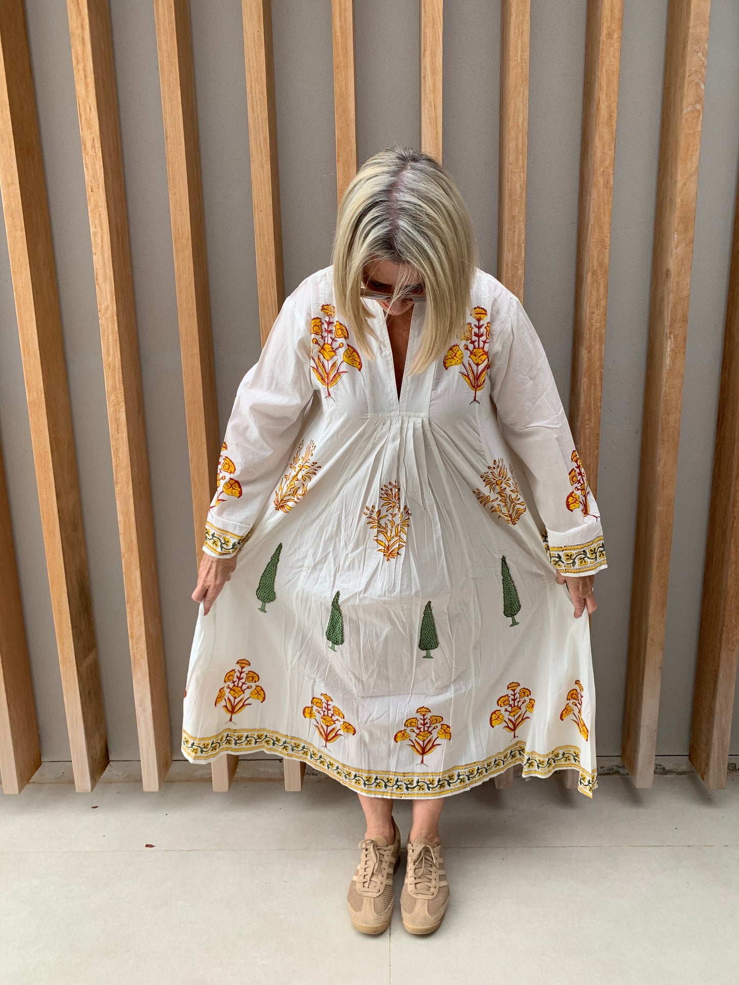 White dress with yellow floral & green conifer pattern