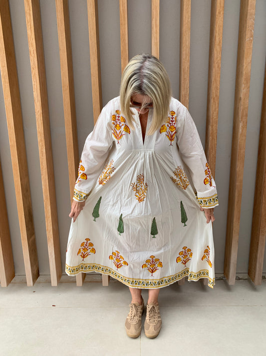 White dress with yellow floral & green conifer pattern