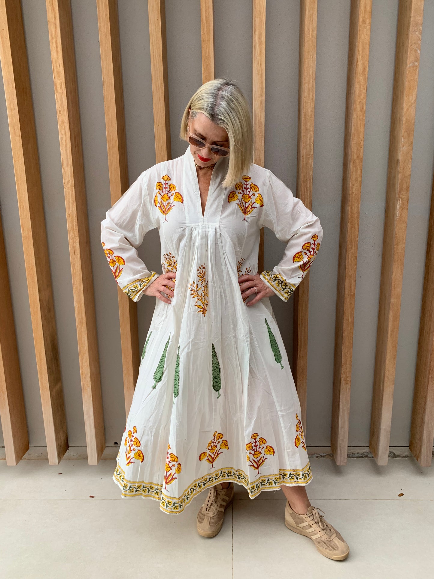 White dress with yellow floral & green conifer pattern