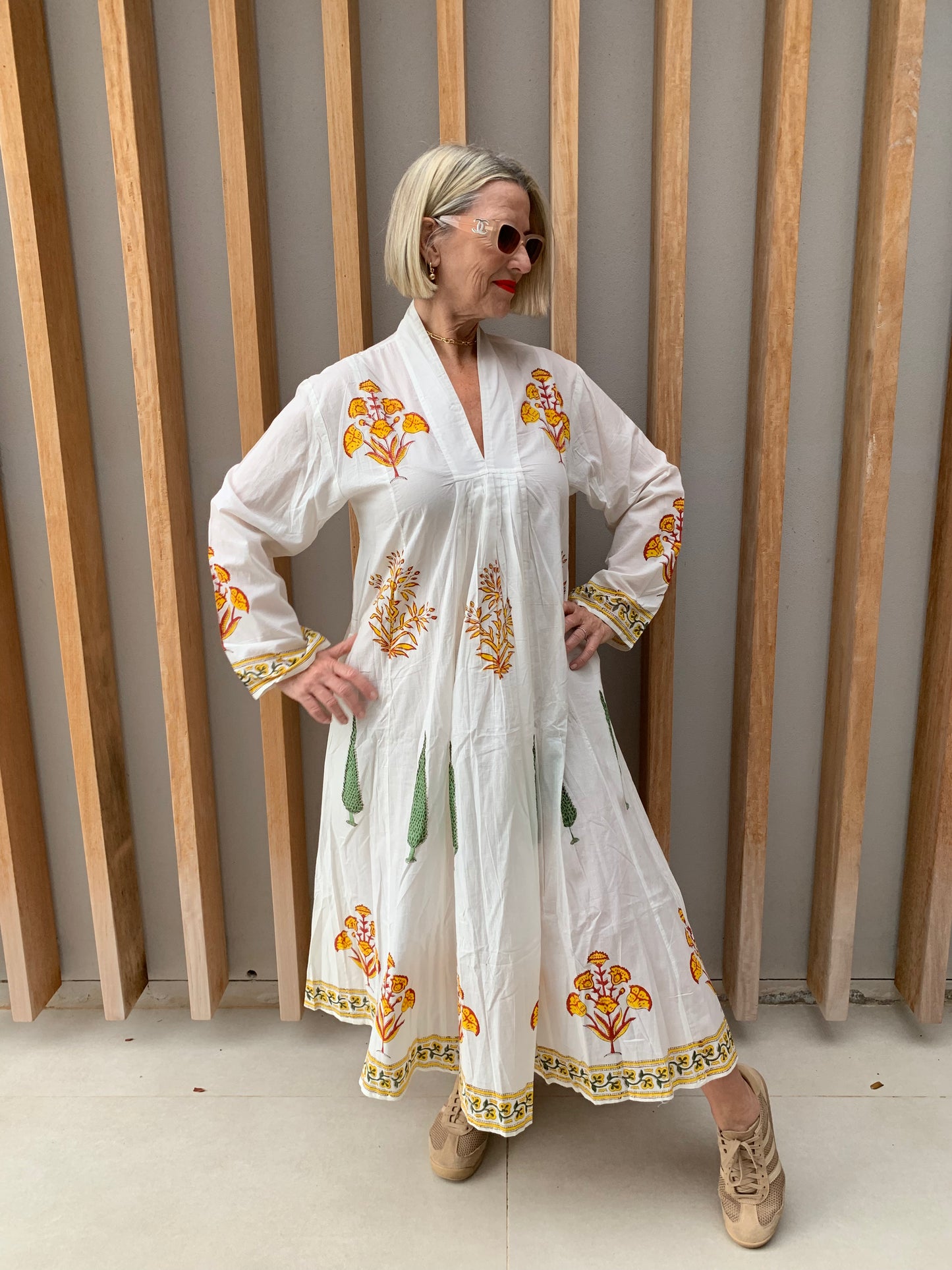 White dress with yellow floral & green conifer pattern