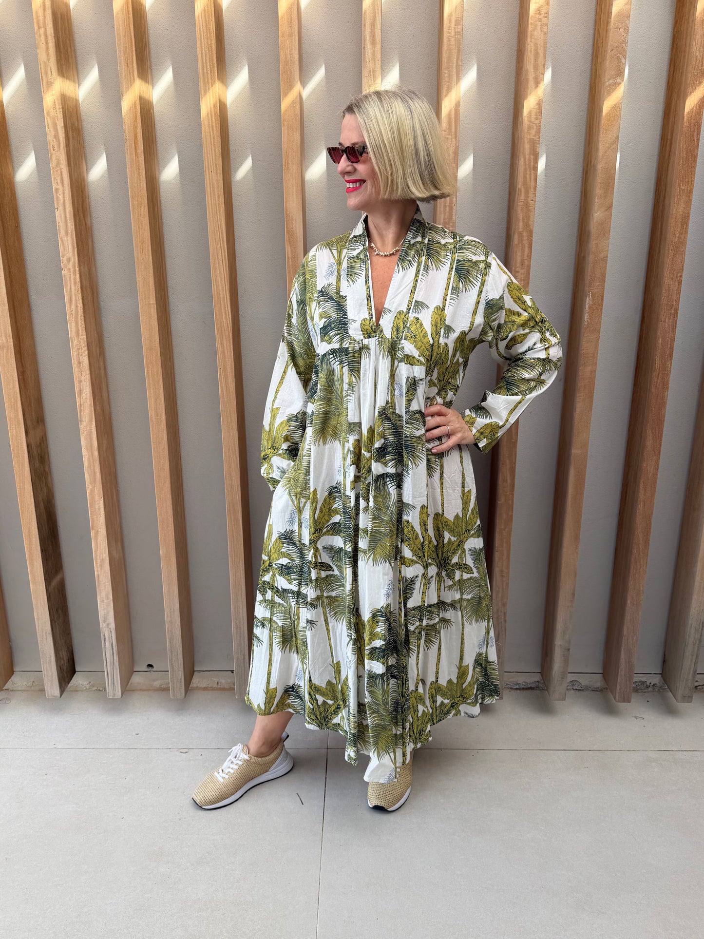 White dress with green floral palm pattern