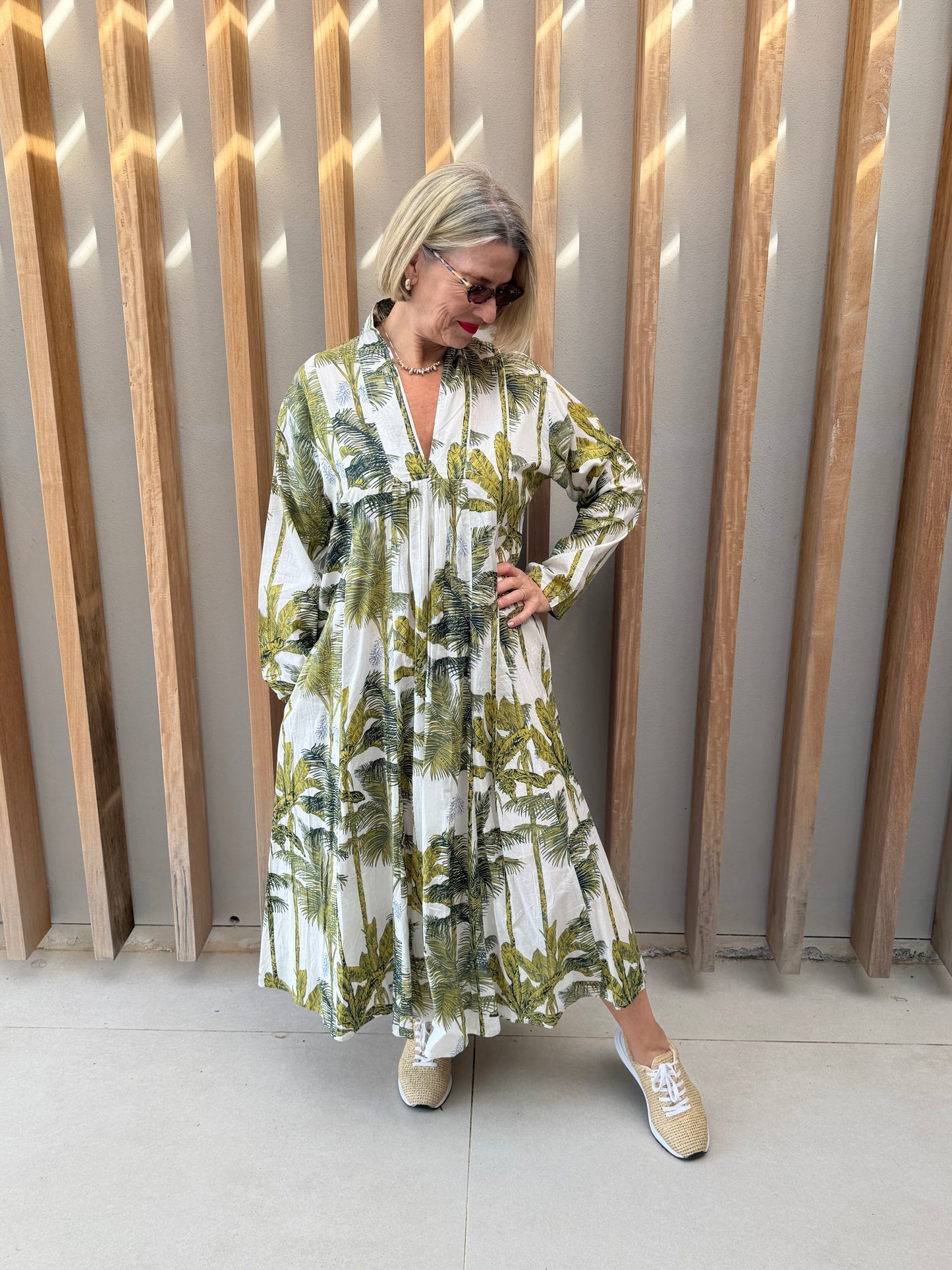 White dress with green floral palm pattern