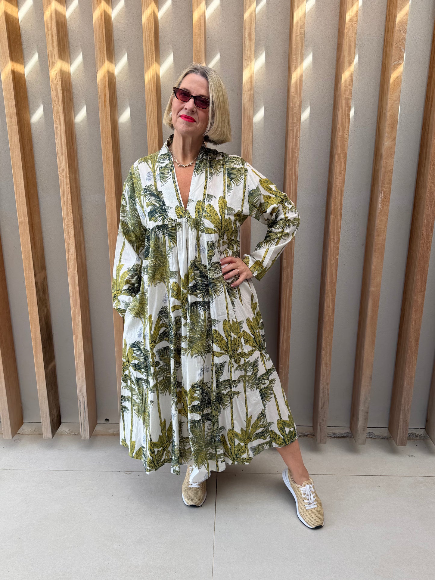 White dress with green floral palm pattern