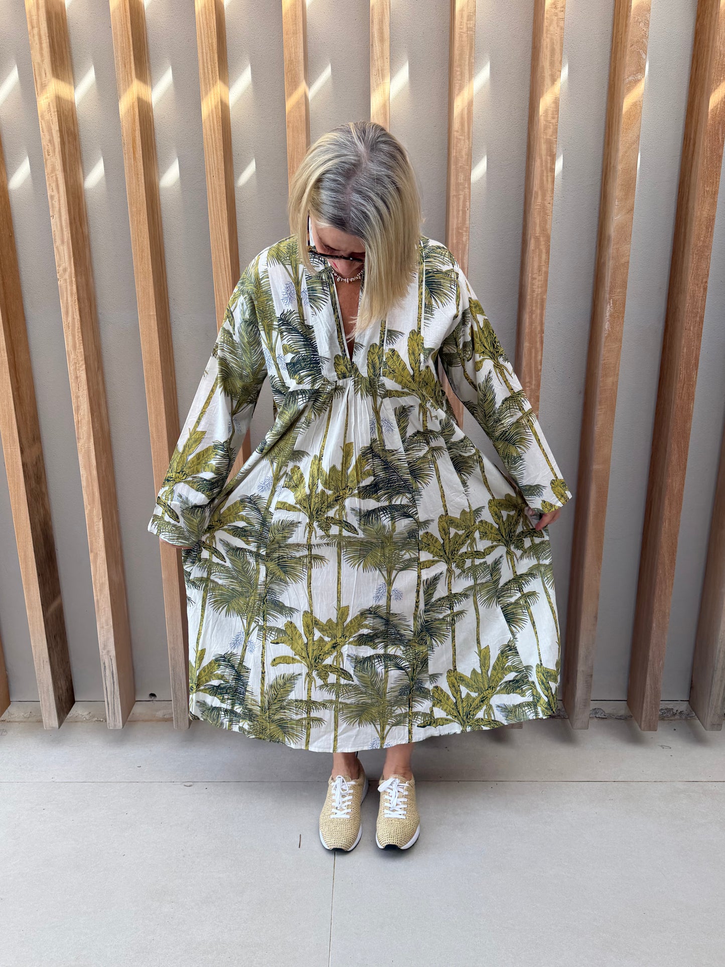 White dress with green floral palm pattern
