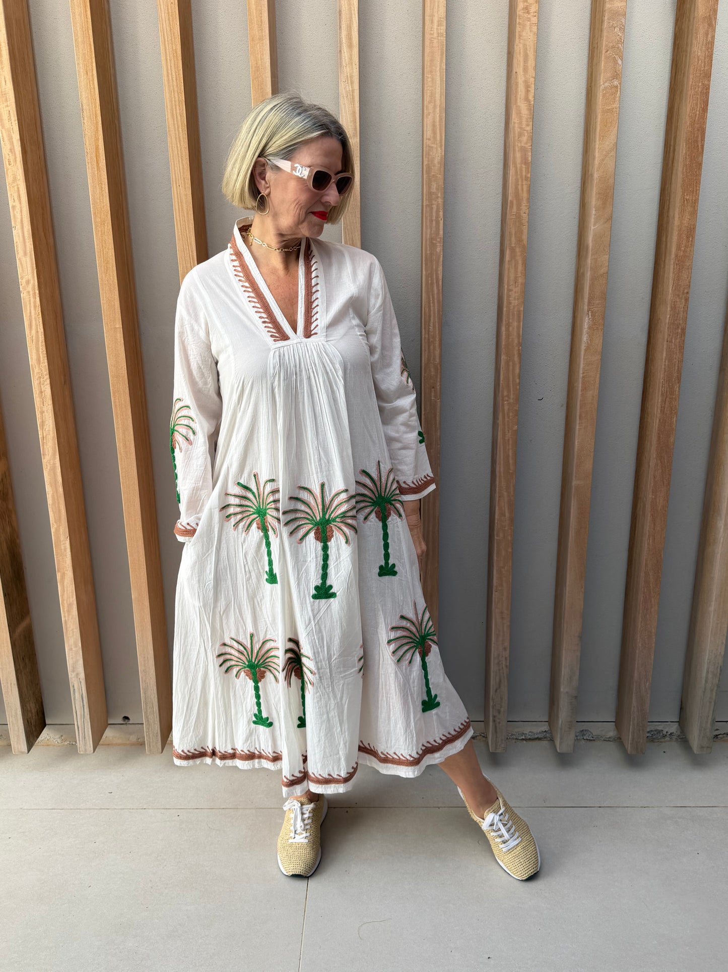 White dress with embroidered green & brown palm